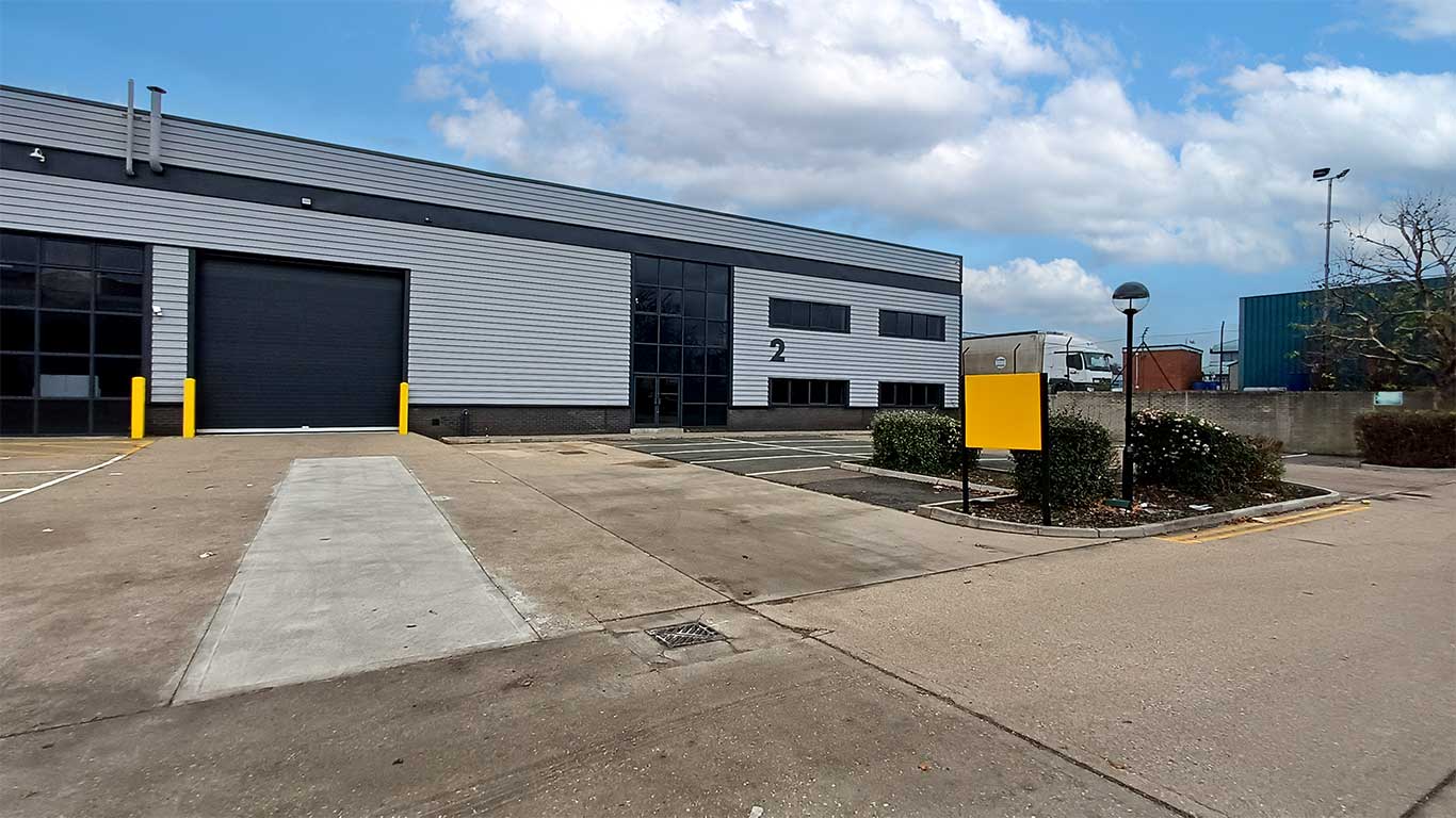 Unit 2 Scimitar Park Basildon - Refurbished industrial warehouse exterior and loading area